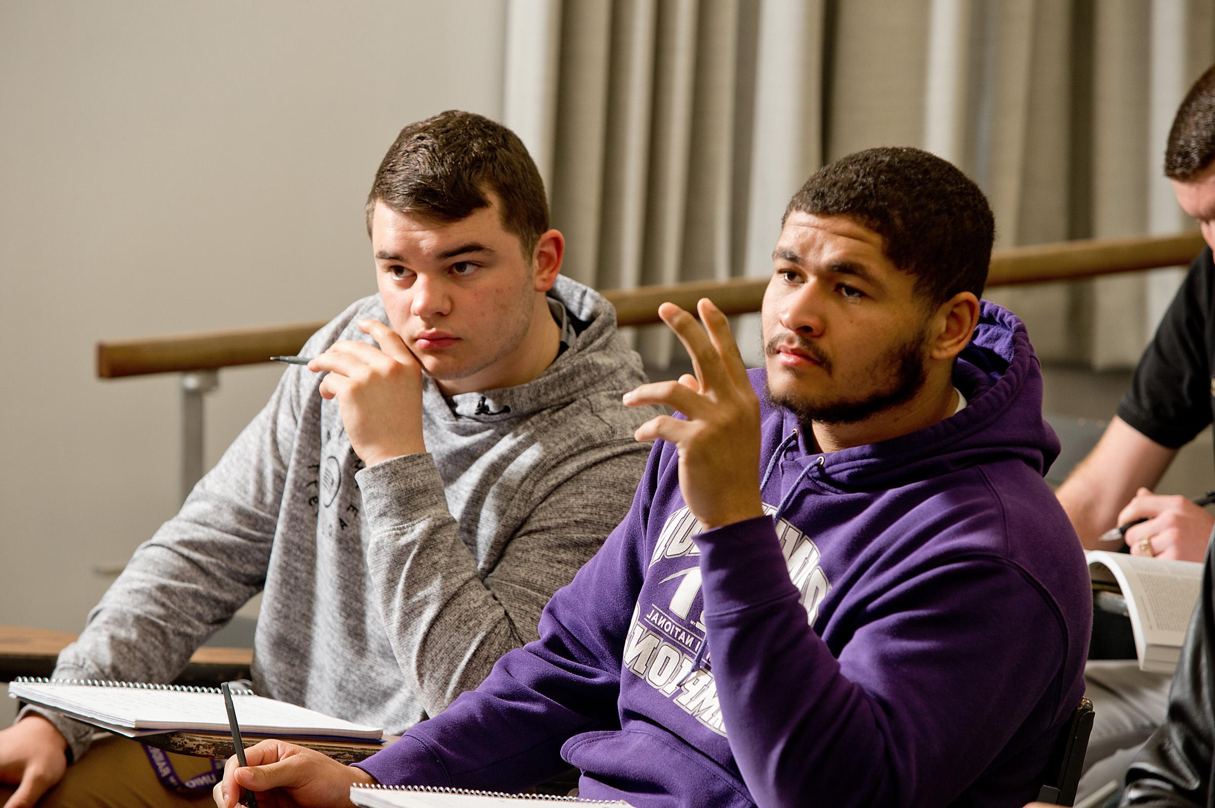 student raising hand